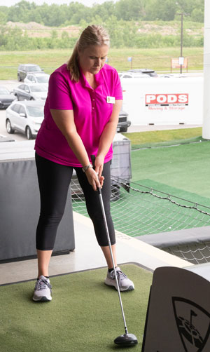 Networking Night and Fundraiser attendee plays a round of Top Golf.