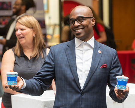 SIUE Chancellor James T. Minor hands out Dairy Queen blizzards to students. 