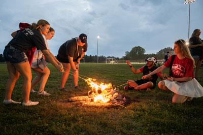 SIUE students make s’mores at the homecoming bonfire.