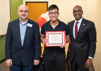 (L-R) Abdullatif Hamad, PhD, chair of the Department of Physics, senior Khoi Minh Pham, and Chancellor James T. Minor, PhD.