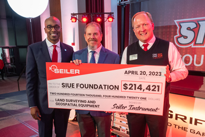 Seiler Instrument and Manufacturing Company presents SIUE with a check for over $214,000 to help launch SIUE’s new land surveying and geomatics degree.  