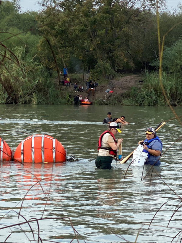 Migrants crossing the Rio Grande