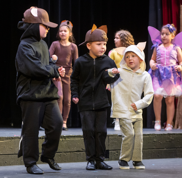 Young children on stage in the Junior Cougars program