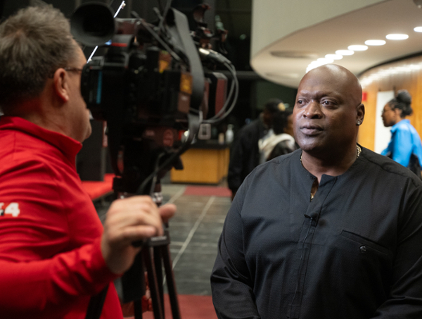 Ike Howard is interviewed by broadcast reporter Steve Harris