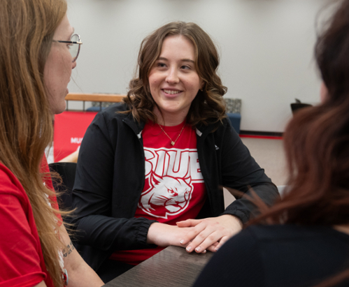 Photo of Mirella Eldridge advising students as a Cougar Connector