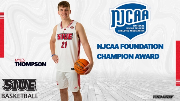 Myles Thompson stands in basketball uniform with basketball