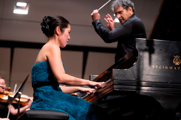 Pianist and conductor in close up photo