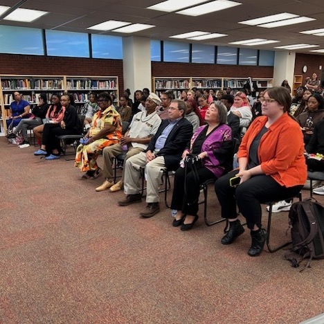 Seated audience listening to lecture