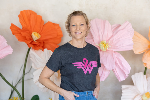 Portrait of Kelly Gable in front of flower decorations