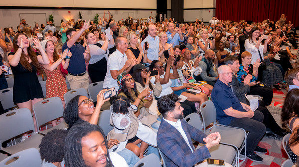 Audience of excited friends and family