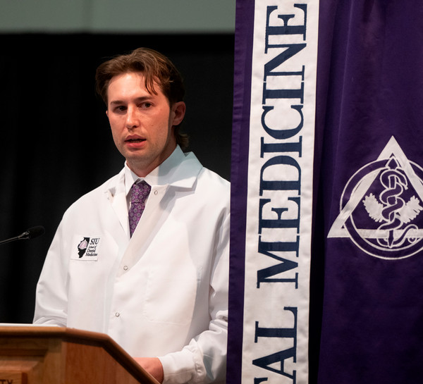 SIU SDM Class President Nick Yuhas gives speech at podium