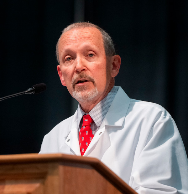 Dr Terry Barnfield gives keynote speech at podium