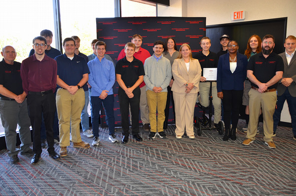 Awardees stand together and pose for camera
