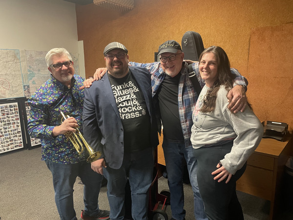 Group of four pose for photo which includes Jim Manley Jason Church and Rick Haydon