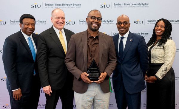 Award winner Howard Rambsy surrounded by university colleagues