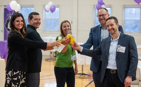 alumni students toast mimosas with SIU SDM Dean Sonny