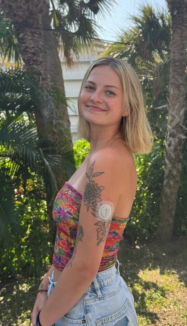 Portrait of Ms Myers in front of tree