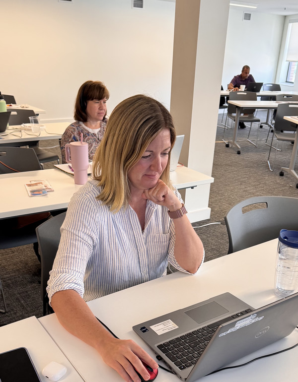 Woman at computer in class