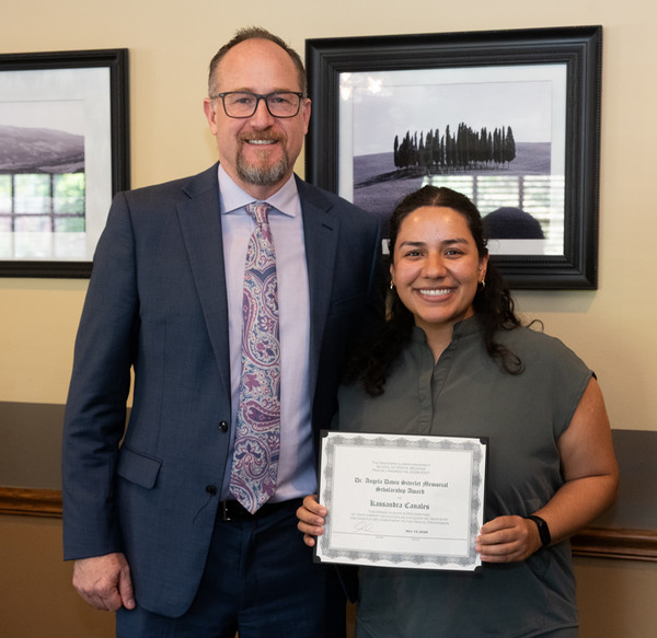 SIU SDM Dean and student holding her award