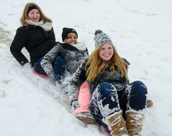 SIUE students sledding in the snow 