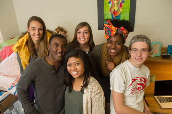 Group of SIUE students in a residence hall room