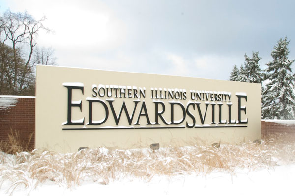 Entrance sign at Southern Illinois University Edwardsville covered in snow