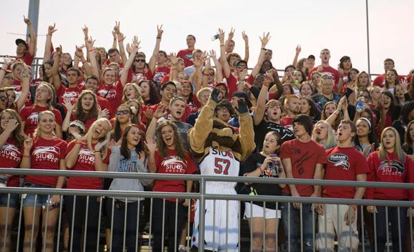 Happy SIUE students at Korte stadium with Eddie the Cougar