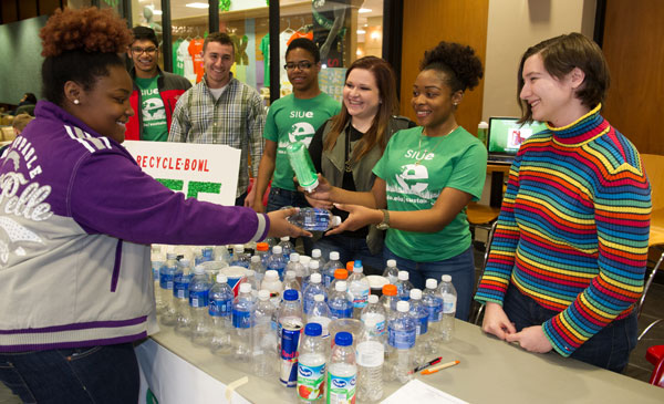 Students exchanging water bottles for refillable bottle