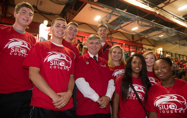Group of students in stadium seats wearing SIUE t-shirt with chancellor