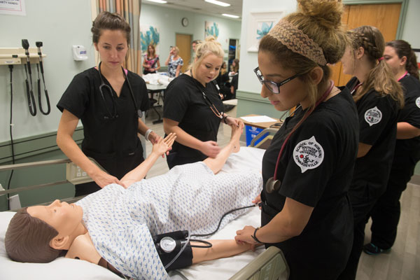 Nursing students in a the simulation lab