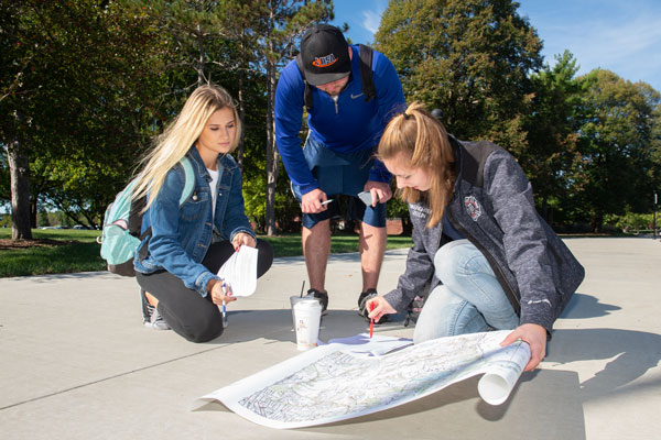 Students on campus participating in class.