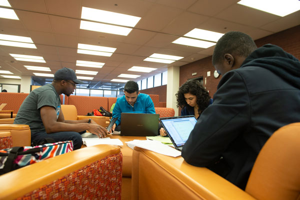 Students studying in the Lovejoy Library