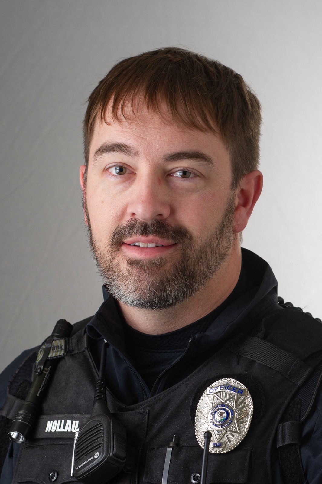 A portrait photo of Justin Nollau, #12-126