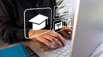 Student typing on a laptop.