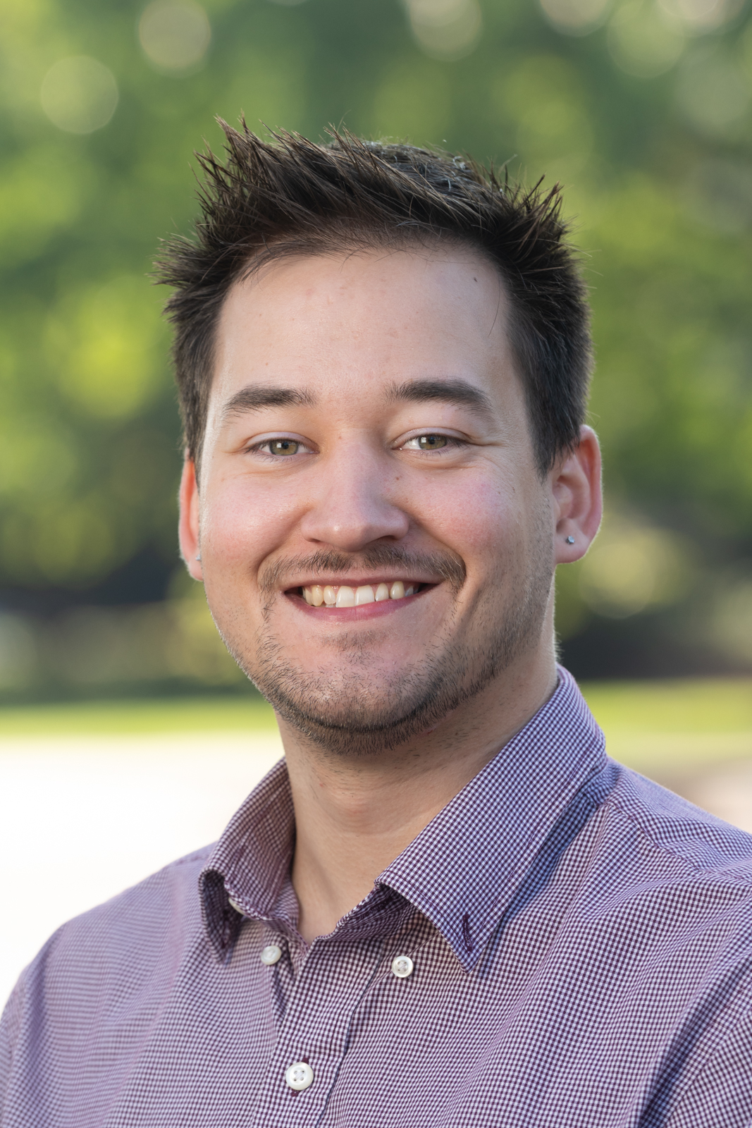 A portrait photo of Evan Lowis