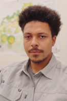 A portrait photo of Adrian Davis